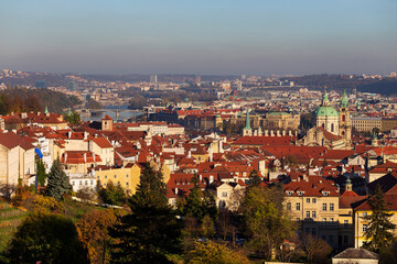 Fototapeta na wymiar Autumn Prague City with colorful Trees from the Hill Petrin, Czech Republic