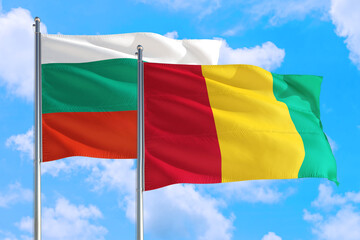 Guinea Bissau and Bulgaria national flag waving in the windy deep blue sky. Diplomacy and international relations concept.