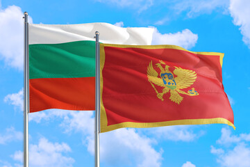 Montenegro and Bulgaria national flag waving in the windy deep blue sky. Diplomacy and international relations concept.