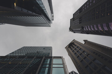 Vertical Look Up View of Tall Skyscrapers during Cloudy Weather with Symmetry Pattern