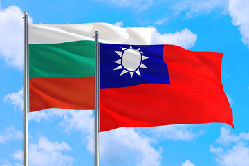 Fototapeta na wymiar Taiwan and Bulgaria national flag waving in the windy deep blue sky. Diplomacy and international relations concept.