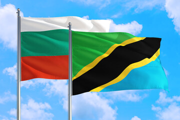 Tanzania and Bulgaria national flag waving in the windy deep blue sky. Diplomacy and international relations concept.
