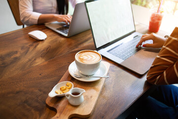 businesswoman hands searching for data on Notebook with analyzing charts at his workplace.concept