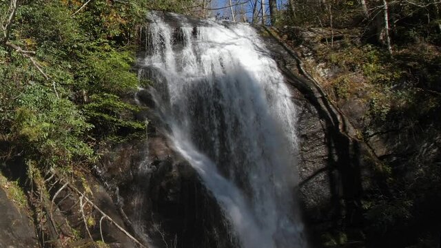 Beautiful waterfall in Anna Ruby falls on autumn day, wide, 60fps