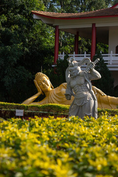 Statue of warrior and Budha in the garden in Foz do Igua&ccedil;&uacute;