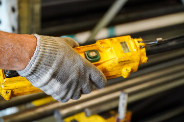 Building crane operator's hand with remote control
