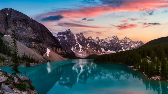 Cinemagraph Continuous Loop Animation. Beautiful view of an Iconic Famous Place, Moraine Lake. Colorful Sunset Sunny Summer Day. Located in Banff National Park, Alberta, Canada.