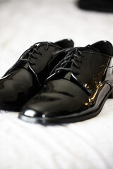 overhead view of mens nice formal dress shoes and tie accessories 