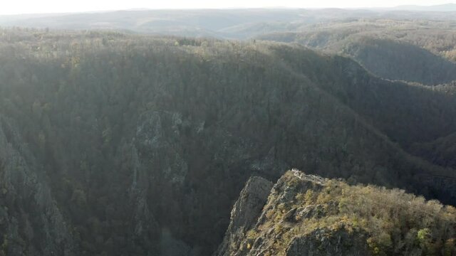 Drone Aerial view of Thale, the Rosstrappen, Hexenstieg, Hexentanzplatz and the Bodetal in the north of the Harz national Park in late autumn at sunset, Germany, Europe