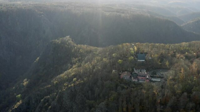 Drone Aerial view of Thale, the Rosstrappen, Hexenstieg, Hexentanzplatz and the Bodetal in the north of the Harz national Park in late autumn at sunset, Germany, Europe