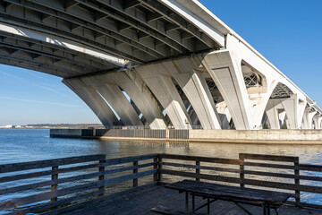Standing on a dock, looking up beneath the Woodrow Wilson Bridge, which spans the Potomac River between Alexandria, Virginia and Prince George's County, Maryland.