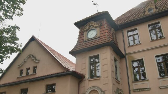 The Clock On The Old Building Shows The Eighth Hour