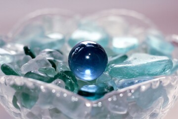 blue bead on the white and blue glass
