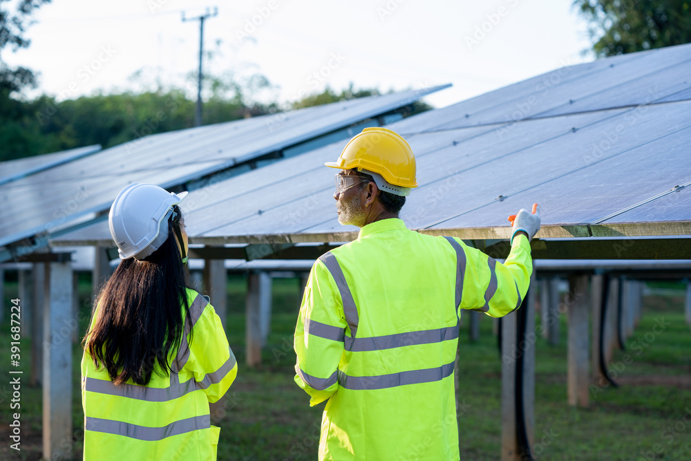 Aufkleber technicians and engineer in long sleeve shirts reflective vests and hard hats discussing something a
