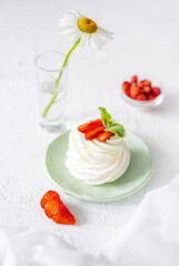 Appetizing cream meringue cake in a breakfast plate