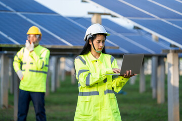 Solar power plant,Engineer working with tablet computer at Solar Panels Power Farm,Science solar energy,Photovoltaic Cell Park.