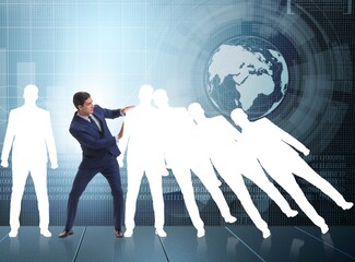 Businessman in domino effect business concept
