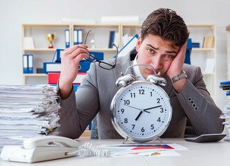 Businessman missing deadlines due to excessive work