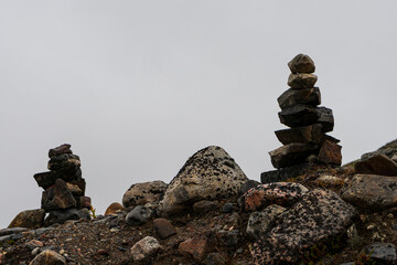 small towers made of stones from travelers on the passes. the legend of wish fulfillment. copyspace