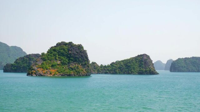 Moving Past the Beautiful Green Limestone Islands of Halong Bay