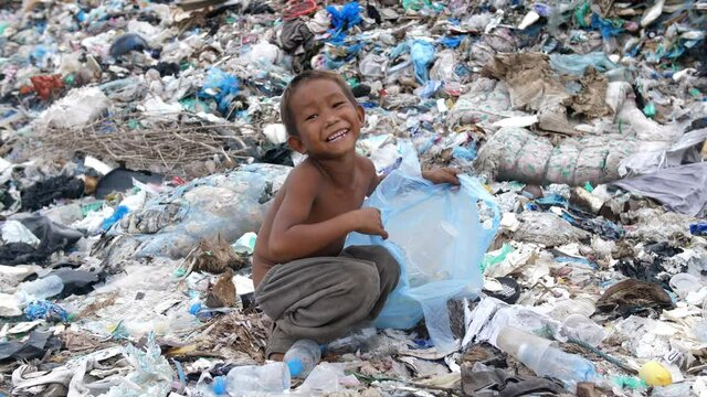 Poverty Boy Collecting Trash For Sell
