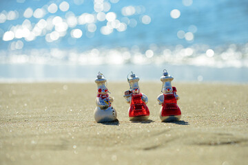 Snowman of sand. Holiday concept for New Year and Christmas.