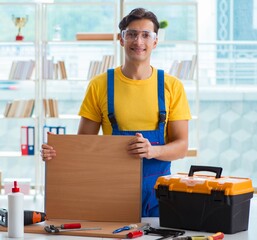 Furniture carpenter working in the workshop