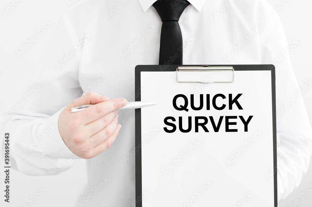 Poster card with text quick survey in the hands of a man on a light background. business concept.