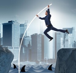 Businessman in pole vaulting concept