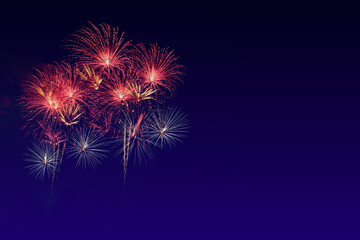 Colorful sparkle light fireworks celebration on twilight night background with copy space.