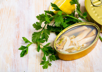 Fototapeta na wymiar Close up of canned seafood - Navajas shellfish in oil