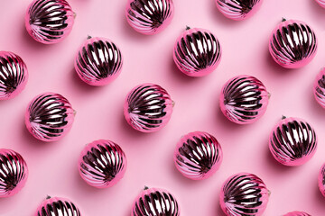 Shiny Christmas balls for decoration on pink background , new year pattern