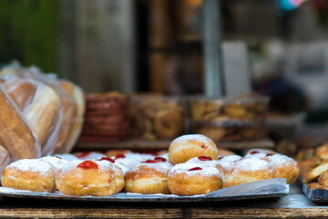 sufganiyot for sale at the Mahane Yehuda market in Jerusalem, a Jewish dish for Hanukkah