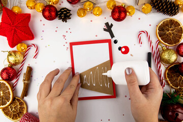DIY step-by-step instructions for a Christmas card with children. Christmas deer on a postcard made...