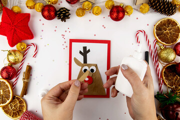 DIY step-by-step instructions for a Christmas card with children. Christmas deer on a postcard made...