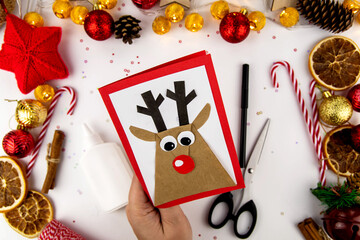 DIY step-by-step instructions for a Christmas card with children. Christmas deer on a postcard made...