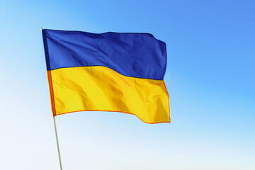 Flag of Great Britain waving against blue sky