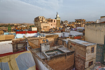 View of the old buildings roofs in medina quarter of Fez in Morocco. The medina of Fez is listed as a World Heritage Site and is believed to be one of the world largest urban pedestrian zones.