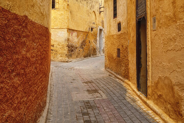 Fototapeta premium Narrow streets of in Meknes medina. Meknes is one of the four Imperial cities of Morocco and the sixth largest city by population in the kingdom.