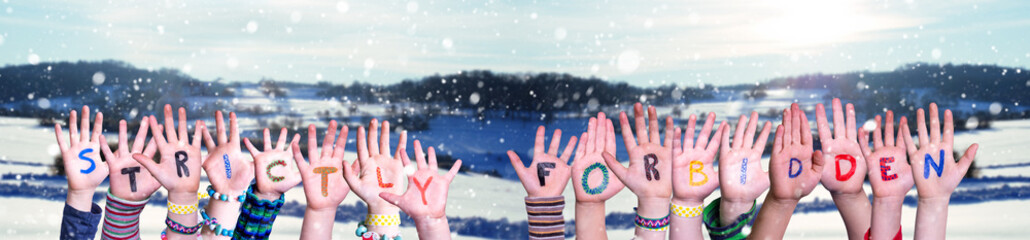 Children Hands Building Colorful English Word Strictly Forbidden. Snowy Winter Background With...