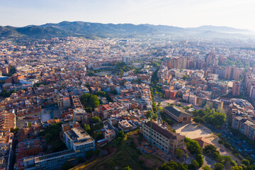 Obraz premium Aerial view of Santa Coloma de Gramenet with a apartment buildings and Besos river, Spain