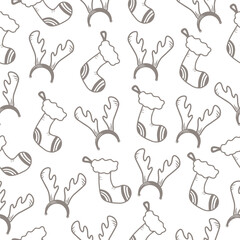 Seamless pattern with hand drawn christmas sock for gifts and reindeer horns head band on a white background. Doodle, simple outline illustration. It can be used for decoration of textile, paper.