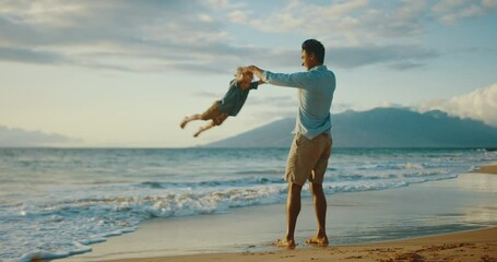 Father and son laughing and playing together on the beach at sunset, quality family time on vacation - Powered by Adobe