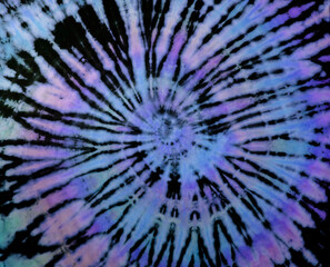 Spiral tie dye texture. Reverse swirl tiedye pattern. Tie-dye background in purple blue. - 391708290