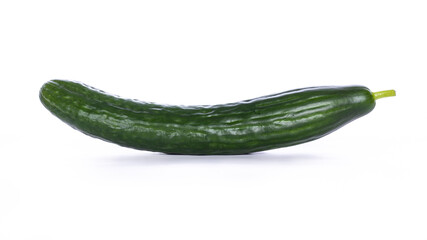 Green slightly curved biological cucumber (Cucumis sativus), isolated on a white background