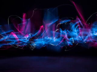 abstract background with lights. Blue and White Light Trails Created in Camera. stock photo