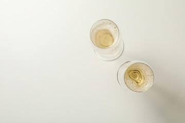 Glasses of champagne on white background, space for text © Atlas