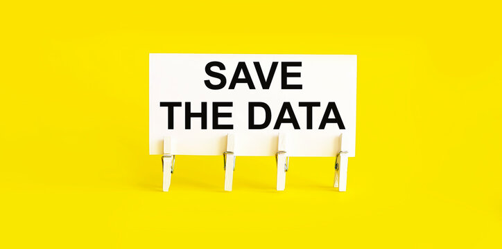 text Save The Date on the white short note paper yellow background