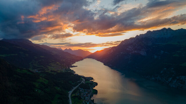 Sunset in a valley with the Wallensee and beautiful mountains on a cloudy day in Flums Switzerland - Drone Perspective Landscape Photography 