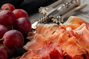 Wooden platter with meat cuts close up